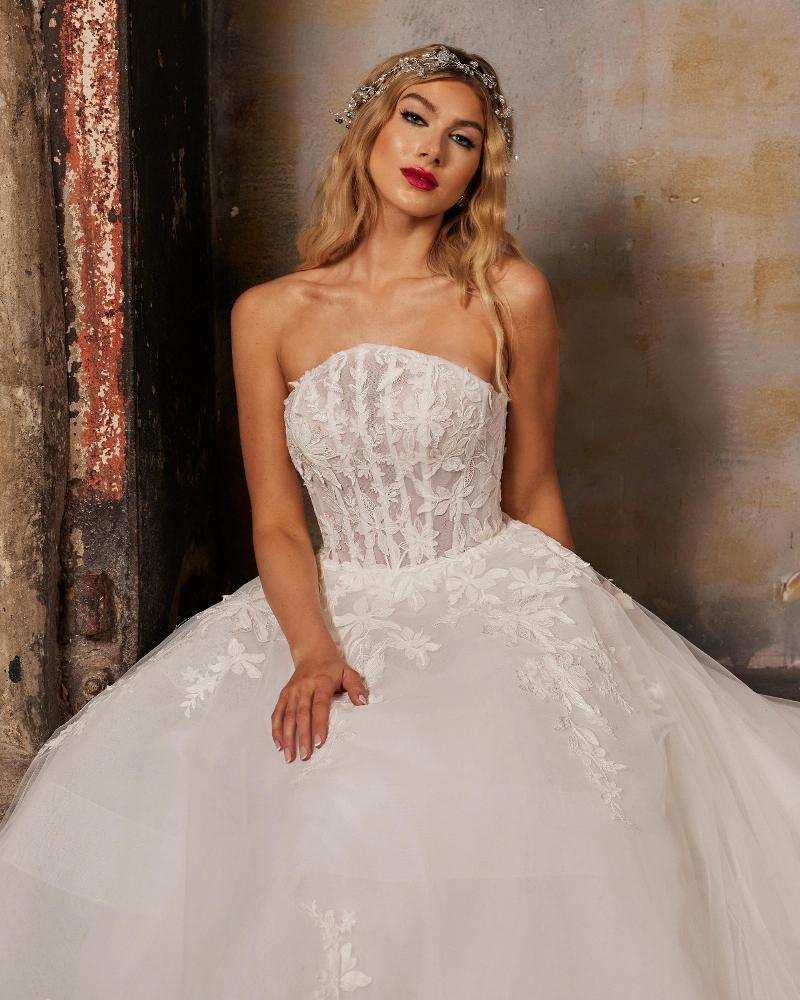 122232 lace strapless wedding dress with long train and ball gown silhouette4